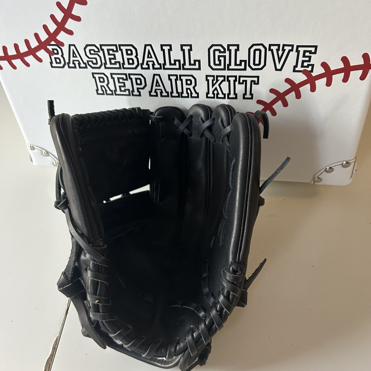 Black baseball glove after full relace